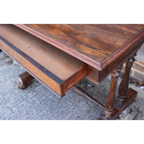 546 - An early Victorian rosewood centre table, fitted one drawer, on twin turned columns and scroll suppo... 