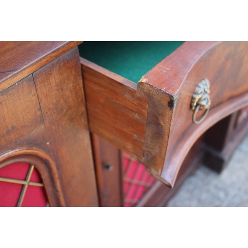 548 - A late 19th century mahogany break serpentine front sideboard, fitted centre drawer and three cupboa... 