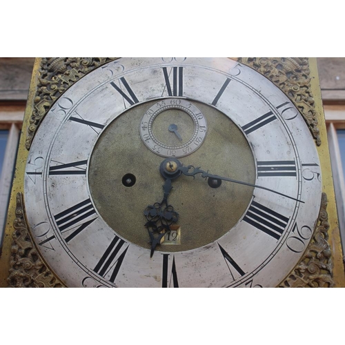 553 - A late Georgian walnut long case clock with arch top, eight-day striking movement, brass dial with s... 