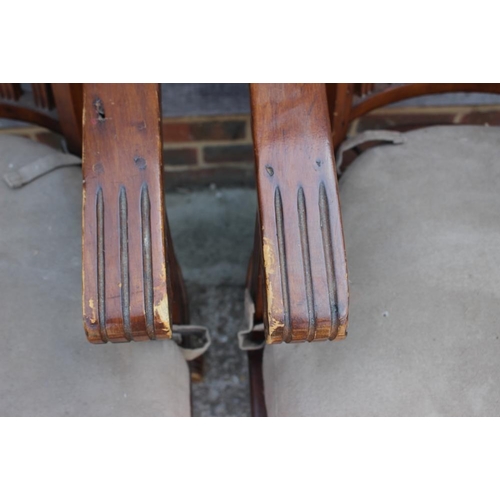 576 - A pair of Edwardian walnut lath back office elbow chairs with panel seats and loose faux suede cushi... 