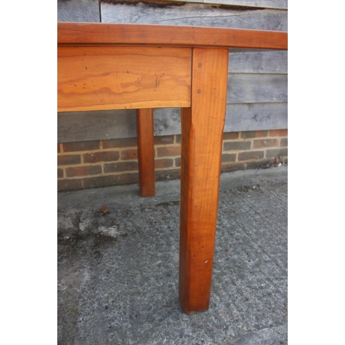 578 - A fruitwood dining table, on chamfered supports, 72