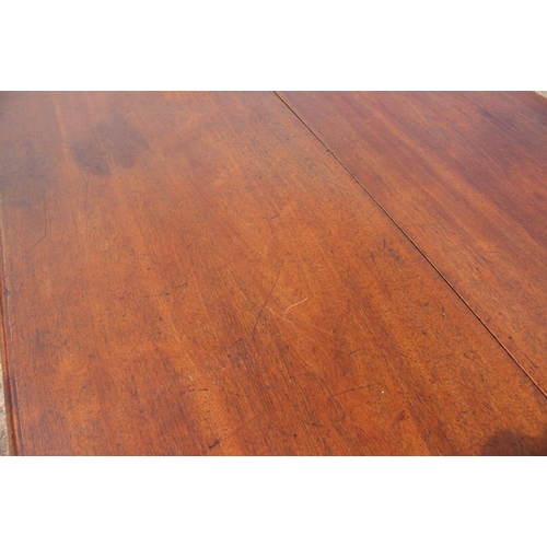 599 - A mahogany oval drop leaf dining table, on chamfered supports, 67