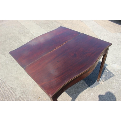 618 - A mahogany and inlaid serpentine front fold-over top tea table of Georgian design, on square taper s... 