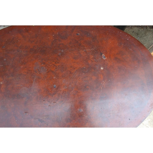 619 - A 1930s burr walnut veneered oval coffee table, on shell carved cabriole supports, 30