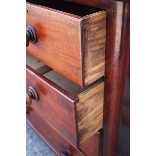 624 - An early 20th century mahogany chest of two short and three long drawers with knob handles, on bun f... 