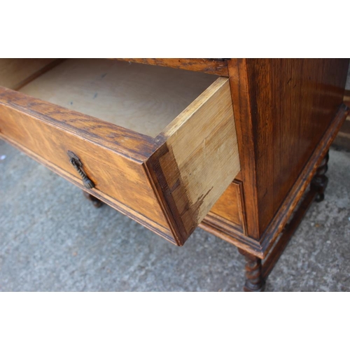 625 - A 1930s oak fall front bureau, fitted two drawers, on barley twist supports, 31