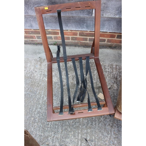 631 - A 1960s teak framed adjustable bed settee and a pair of matching armchairs, on turned supports (for ... 