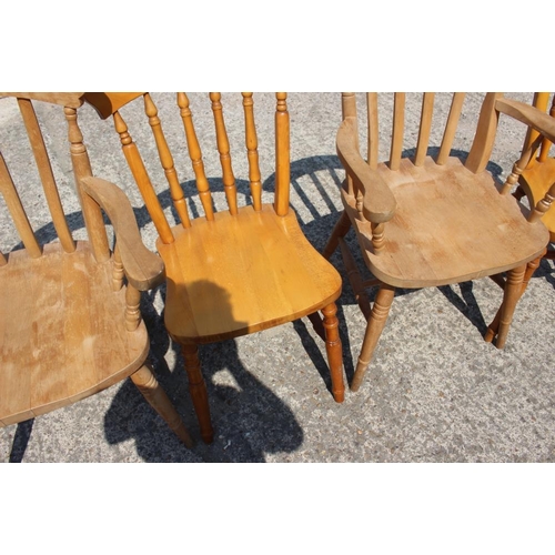 632 - A pair of lath back elbow chairs with panel seats and a pair of similar spindle back chairs