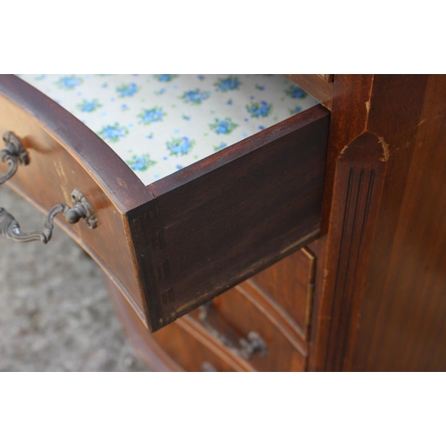 654 - A mahogany and banded serpentine chest of four long graduated drawers with brushing slide over, 27