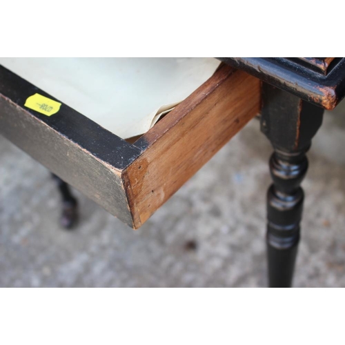 659 - An Edwards & Roberts ebonised square tray top occasional table, on slender turned supports, 19