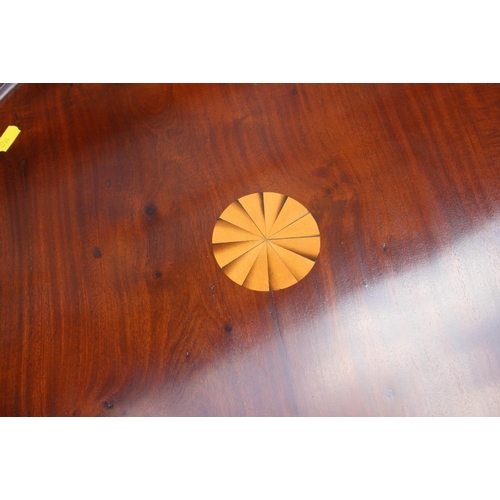 660 - A mahogany and fan paterae inlaid circular tilt top wine table, on tripod splay supports, 2 1/2