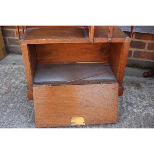 662 - An mahogany and pine revolving bookcase, fitted two drawers, 19