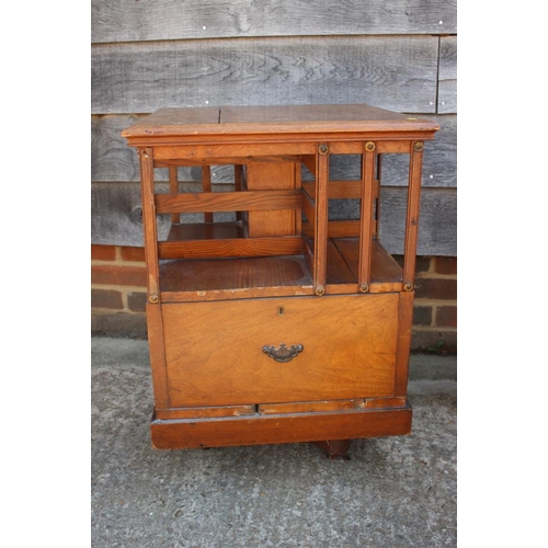 662 - An mahogany and pine revolving bookcase, fitted two drawers, 19