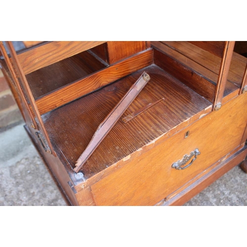 662 - An mahogany and pine revolving bookcase, fitted two drawers, 19