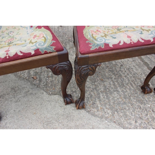 673 - A set of eight carved mahogany Chippendale design dining chairs with pierced splat backs and needlew... 