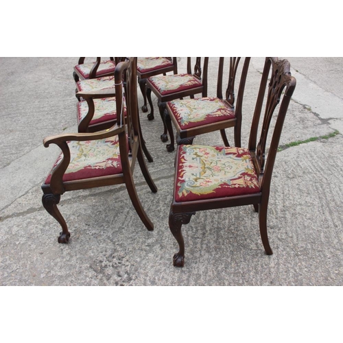 673 - A set of eight carved mahogany Chippendale design dining chairs with pierced splat backs and needlew... 