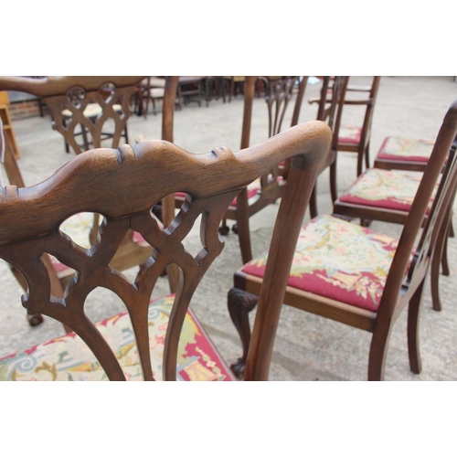 673 - A set of eight carved mahogany Chippendale design dining chairs with pierced splat backs and needlew... 