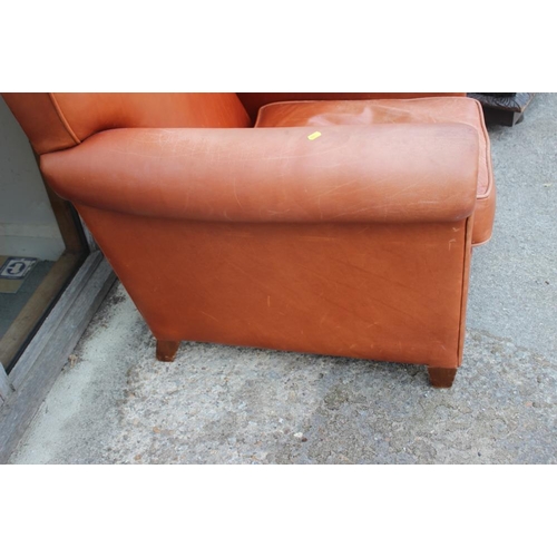 679 - A Conran natural tan leather armchair with loose seat cushion, on square taper supports