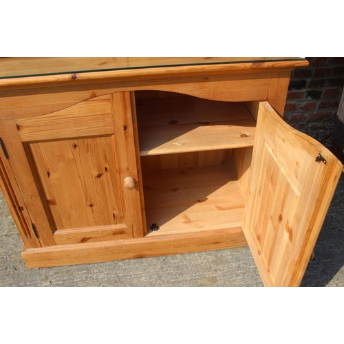 686 - A pine display bookcase enclosed two glazed doors over two cupboards, on block base, 45