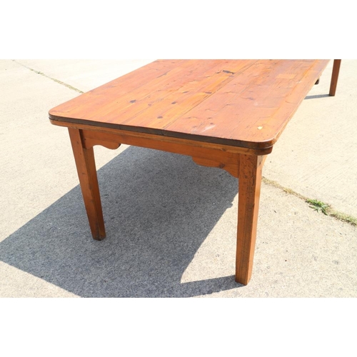 693 - A waxed pine plank top kitchen table, on square taper supports, 120