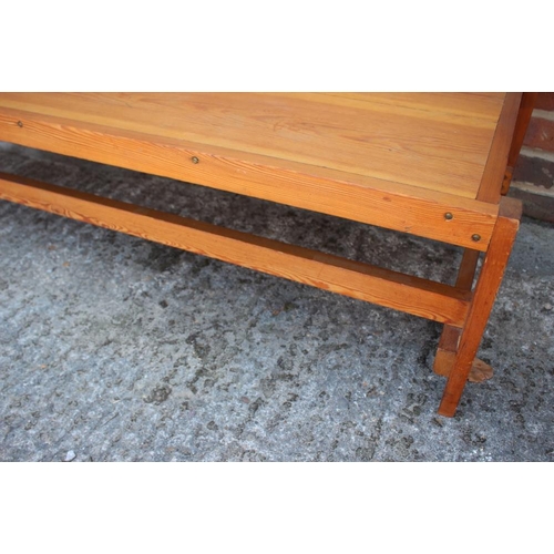 694 - A 1960s pine low coffee table, 52