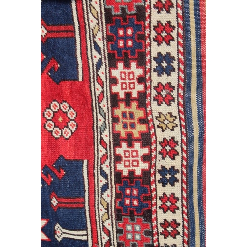 700 - A pair of Konya tribal rugs with lamp design on a red ground and multi-star borders in shades of red... 