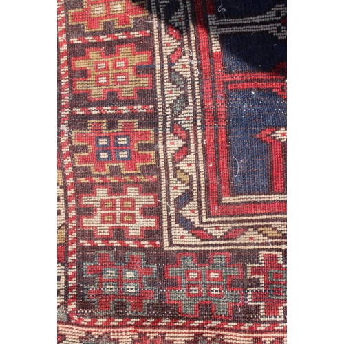 700 - A pair of Konya tribal rugs with lamp design on a red ground and multi-star borders in shades of red... 