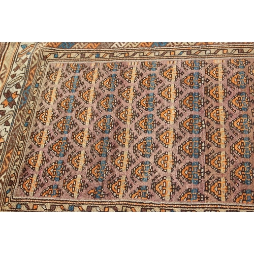 705 - A Caucasian runner with all-over boteh design on a plum ground and multi-bordered in shades of orang... 