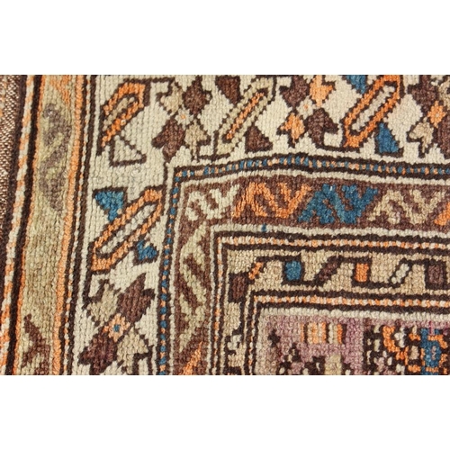 705 - A Caucasian runner with all-over boteh design on a plum ground and multi-bordered in shades of orang... 