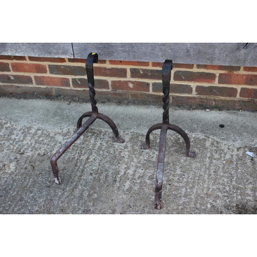 712 - A pair of wrought iron fire dogs, 18