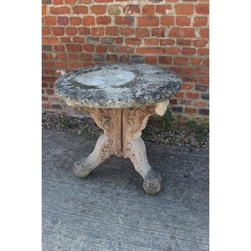 713 - A cast stone garden table, on 'X' frame support, 26