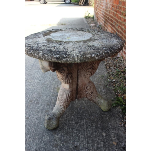 713 - A cast stone garden table, on 'X' frame support, 26