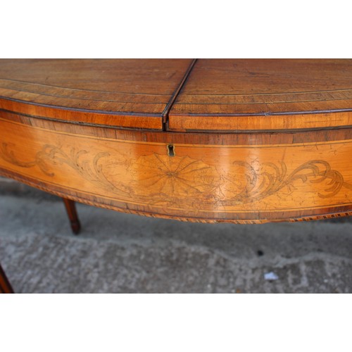 549 - A George III mahogany, satinwood inlaid and banded serpentine-front desk with ledge back and flap to... 