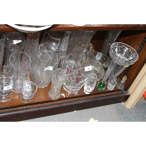 87 - A quantity of glass vases, bowls and bottles, including a trumpet vase, 15