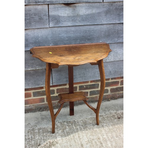 650 - An Edwardian walnut two-tier occasional table on splay supports, 16