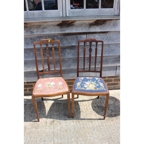 650 - An Edwardian walnut two-tier occasional table on splay supports, 16