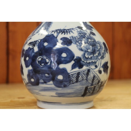 118 - A Chinese porcelain blue and white fence and peony decorated bottle vase, 9 1/2