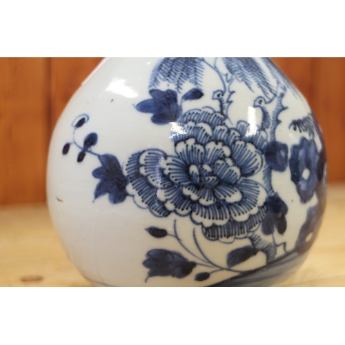 118 - A Chinese porcelain blue and white fence and peony decorated bottle vase, 9 1/2