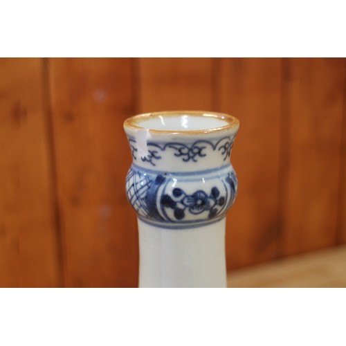 118 - A Chinese porcelain blue and white fence and peony decorated bottle vase, 9 1/2