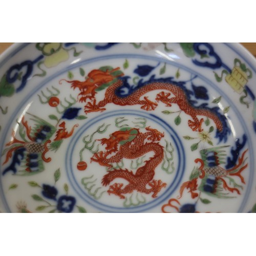 110 - A Chinese saucer dish, decorated red and green dragons with six character mark to base, 4 1/3