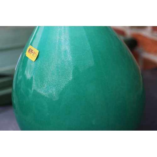 111 - A Chinese oviform monochrome green glazed vase, on associated hardwood stand, 10 3/4