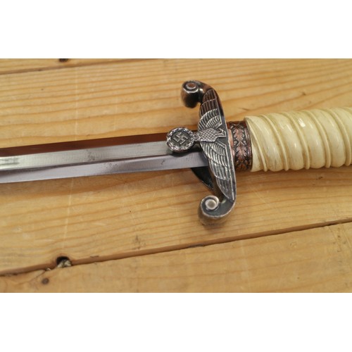 173 - An officer's German army dagger, in metal scabbard, maker F Herder, 15 1/4