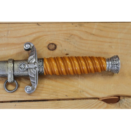 175 - An officer's German army dagger, in metal scabbard with aluminium crossguard and aluminium pommel, n... 