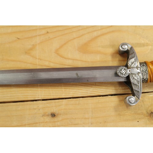 175 - An officer's German army dagger, in metal scabbard with aluminium crossguard and aluminium pommel, n... 