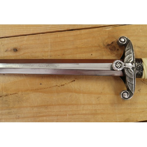 176 - An officer's German army dagger, in metal scabbard, no maker, 15 1/2