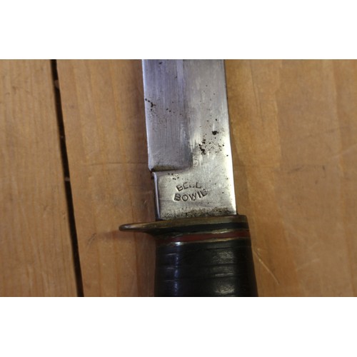 180 - A Bell's Bowie knife, in leather sheath, 9