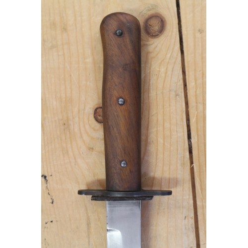 180 - A Bell's Bowie knife, in leather sheath, 9