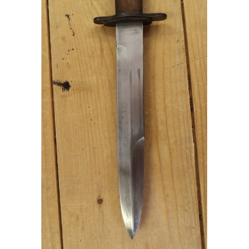 180 - A Bell's Bowie knife, in leather sheath, 9