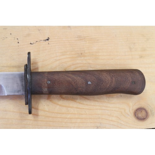 180 - A Bell's Bowie knife, in leather sheath, 9