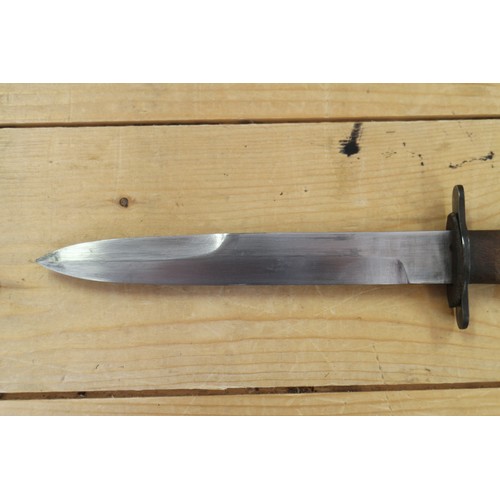 180 - A Bell's Bowie knife, in leather sheath, 9